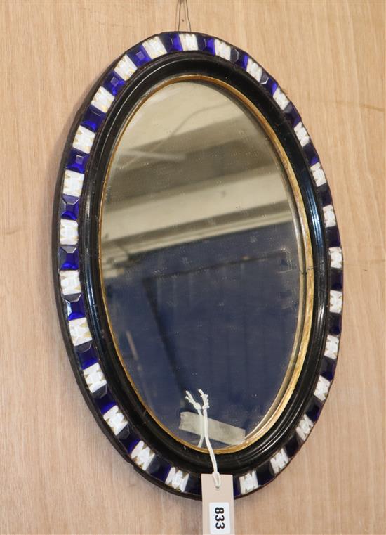 A small Irish style oval wall mirror H.49cm